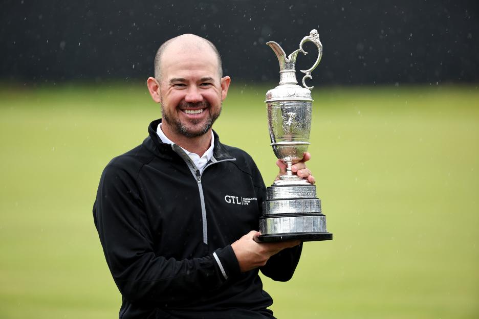 Brian Harman holding the Claret Jug after winning The Open.
