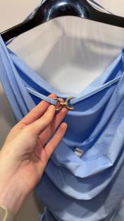 Two dressy tops in black and light blue.