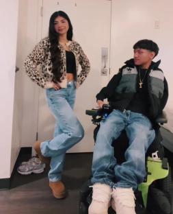 A woman and a man in a wheelchair.