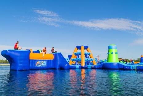 Aqua park inflatable obstacle course on a lake.