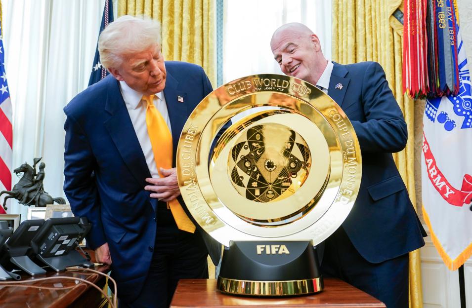 Donald Trump and Gianni Infantino with the FIFA Club World Cup trophy.