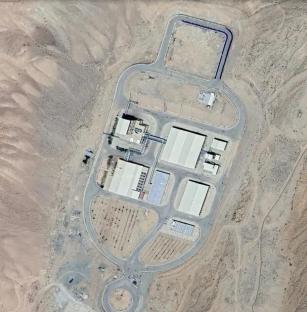 Aerial view of a facility in a desert landscape.
