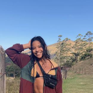 Juliana Marins, missing backpacker, smiling outdoors.