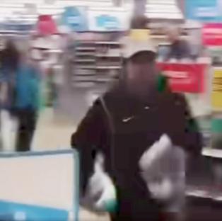 Shop worker apprehending a shoplifter.