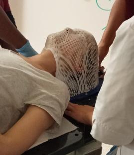 Woman undergoing radiotherapy treatment.