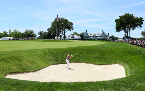 Rory McIlroy hitting a bunker shot at the U.S. Open.