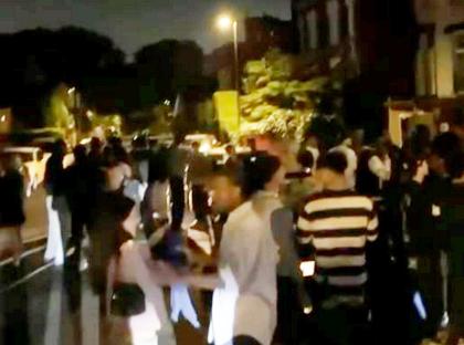 Large group of students at a noisy party.