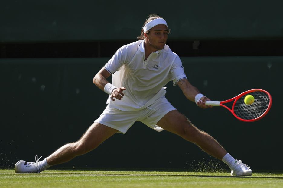 Mattia Bellucci of Italy playing tennis.