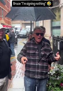 Bruce Springsteen refusing to sign autographs in the rain.