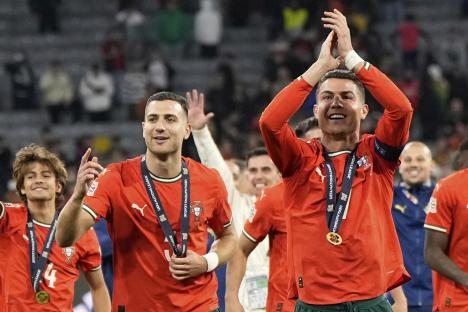 Cristiano Ronaldo and the Portuguese soccer team celebrating a victory.