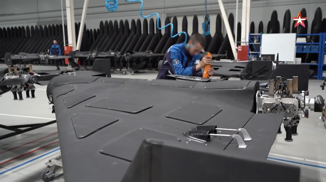 A worker assembling a Geran-2 drone in a factory.