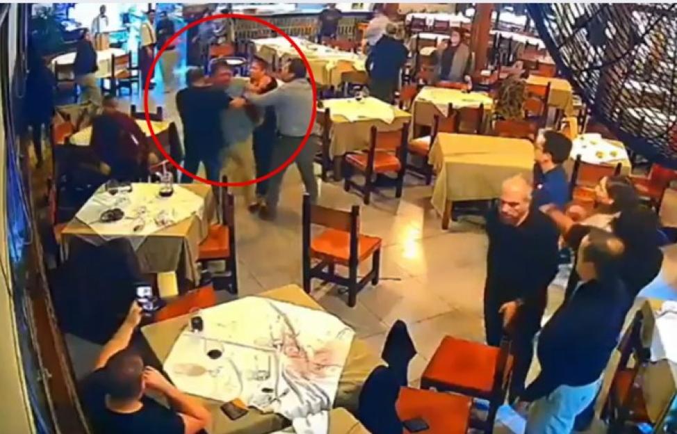 Surveillance footage of a restaurant brawl.