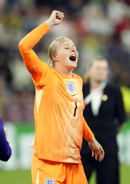 Hannah Hampton of England celebrates a victory.