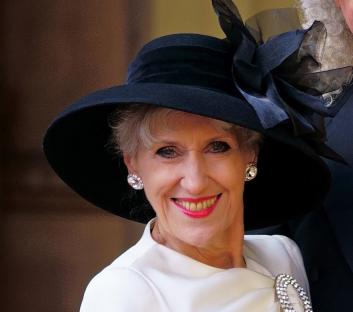 Sir Brian May and Anita Dobson at Buckingham Palace after receiving honors.
