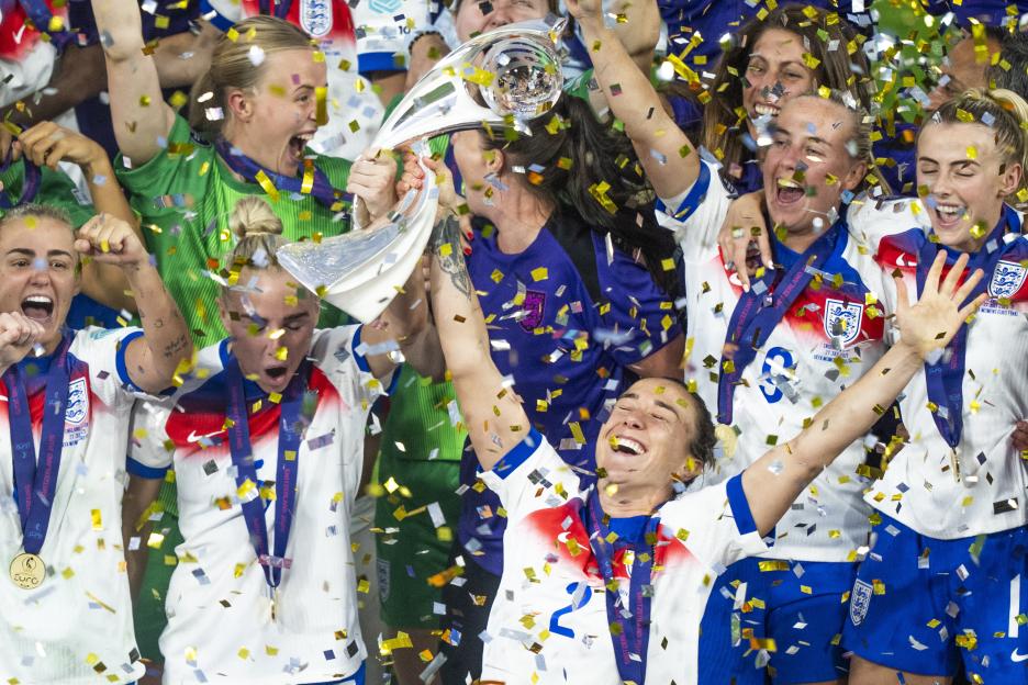 England's Lucy Bronze lifts the trophy after winning the UEFA Women's EURO final.