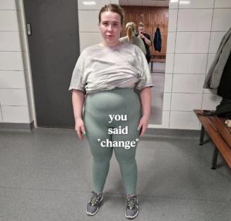 Woman in a gym locker room, wearing gray workout clothes; text overlay says