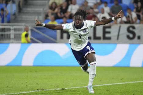 Jonathan Rowe celebrating a goal during a soccer match.