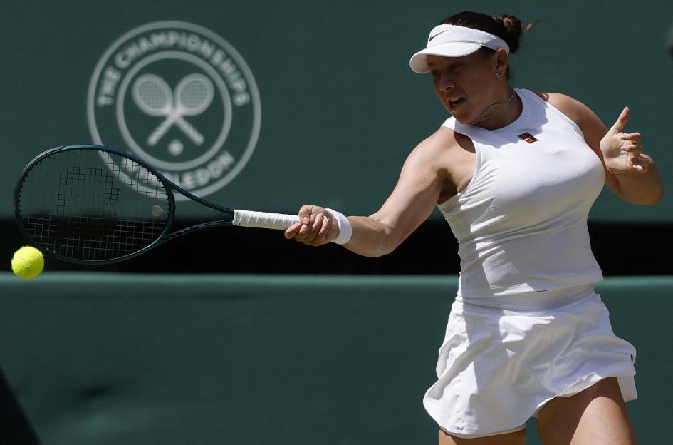 Amanda Anisimova reacts during a Wimbledon tennis match.