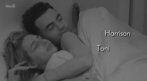 Toni and Harrison asleep in bed.