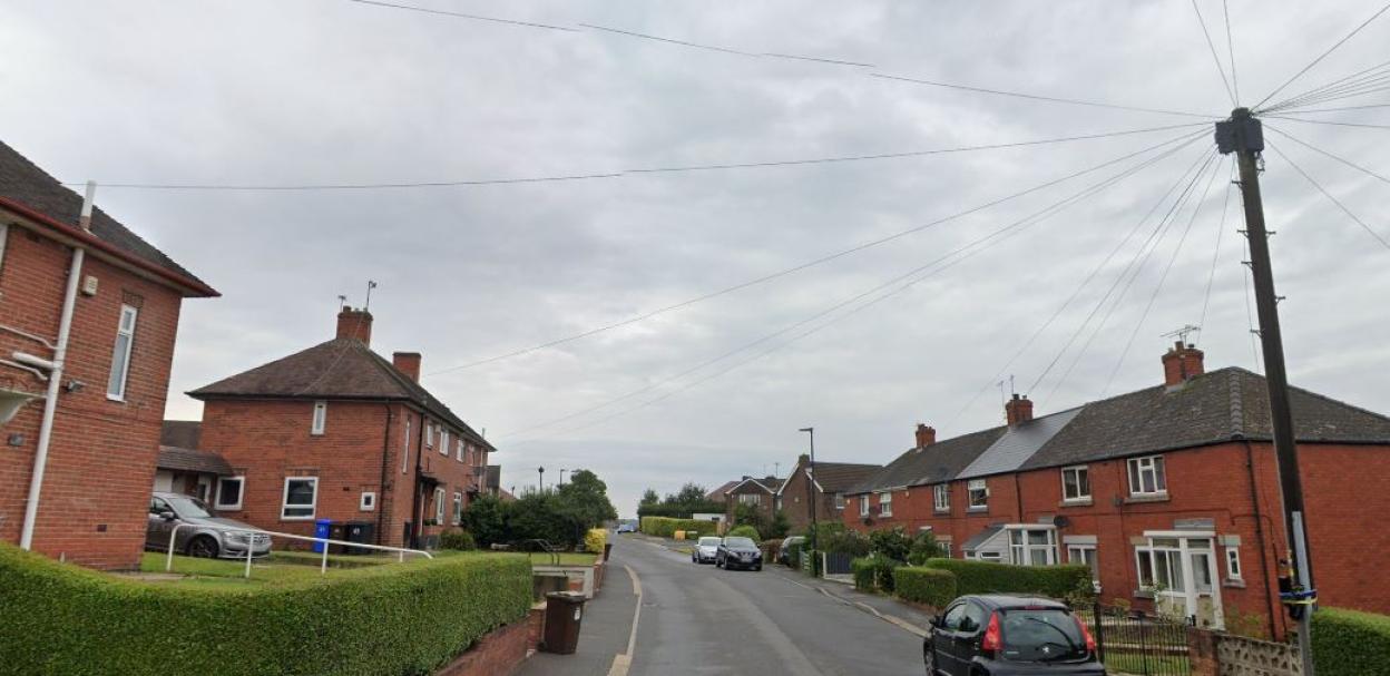 Residential street with brick houses.