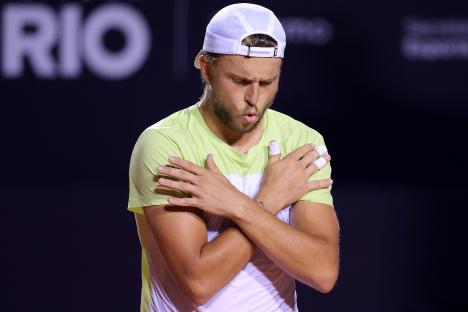 Alexandre Müller of France celebrates a tennis match victory.