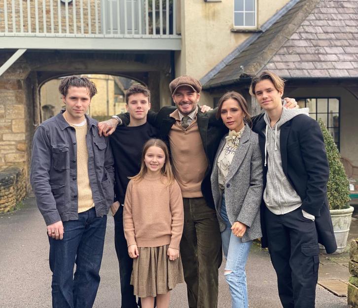 The Beckham family posing for a photo.