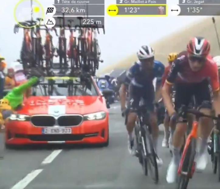 A Tour de France Ineos team car crashes into a fan.