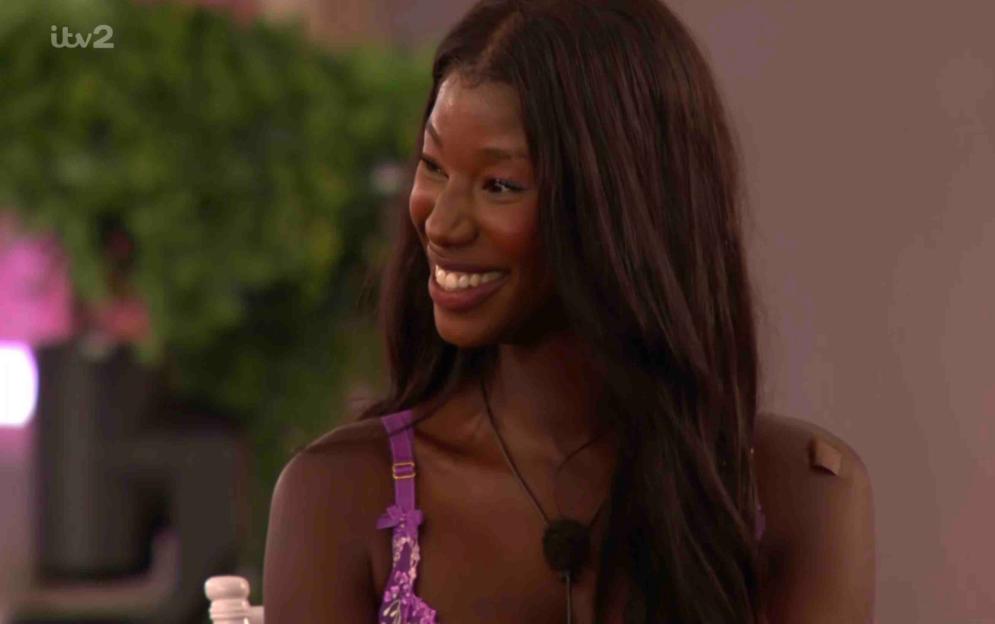 Smiling woman on Love Island.