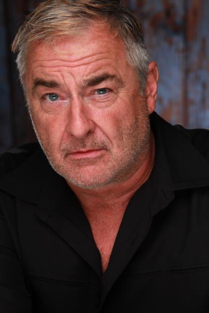 Headshot of John Blundell.