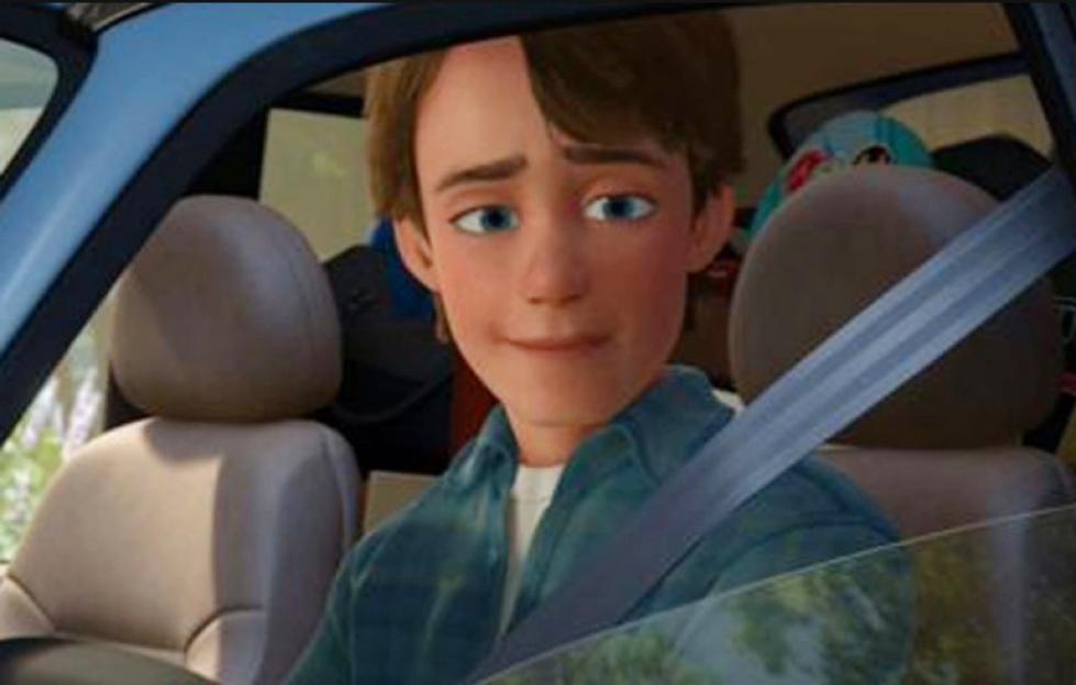 Andy from Toy Story 3 driving away in a car.