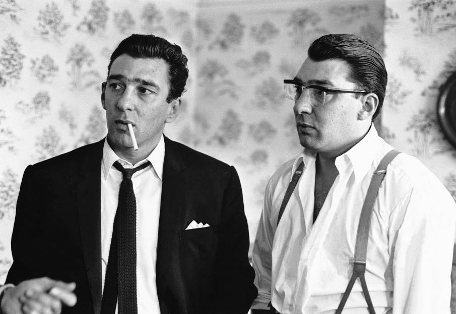 Black and white photo of Reg and Ron assisting police with a murder inquiry.