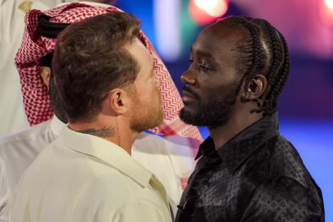 Terence Crawford and Canelo Alvarez face off at a press conference.