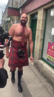 Tyson Fury wearing a kilt and tie.