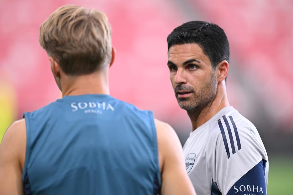 Mikel Arteta and Martin Odegaard at an Arsenal training session.