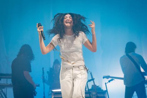 Lorde performing at a music festival.
