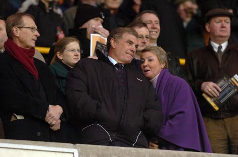Sir Trevor Brooking and his wife watching a West Ham United game.