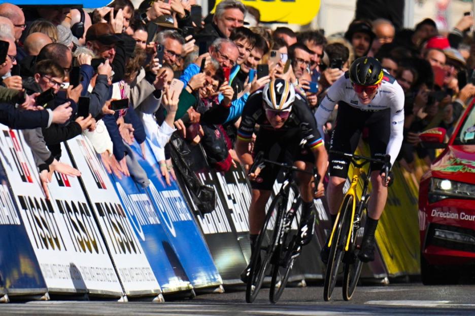 Belgium's Remco Evenepoel, left, and Matteo Jorgensen of the U.S. sprint to the line during eighth and final stage of the Paris-Nice cycling race in Nice, Sunday, March 10, 2024. (AP Photo/Daniel Cole)