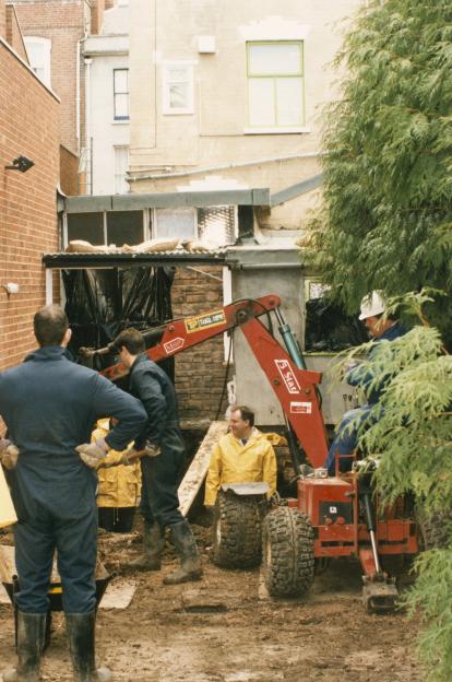 Police excavating a garden.