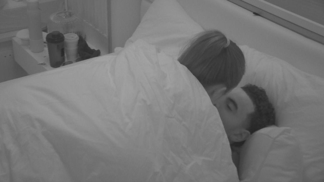 Lauren and Harrison asleep in bed together.