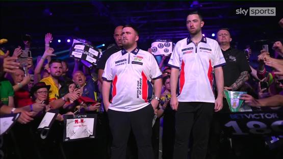 Luke Littler and Luke Humphries at a darts tournament.
