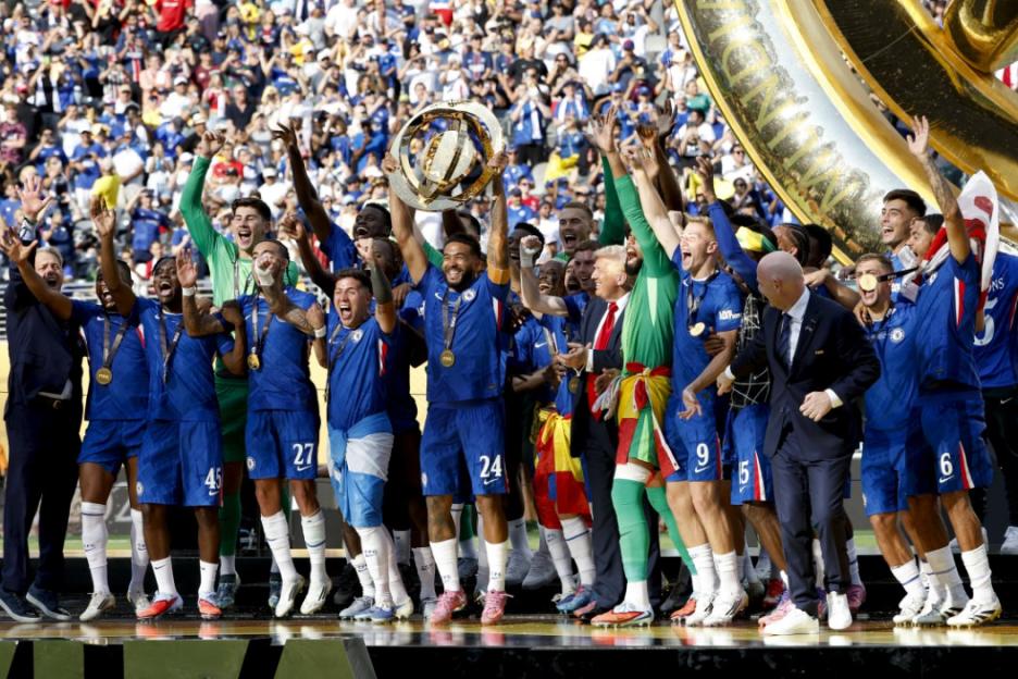 EAST RUTHERFORD, NEW JERSEY - JULY 13: Captain of Chelsea Reece James - holding the trophy - and teammates celebrate during the trophy ceremony following the FIFA Club World Cup 2025 final football match between Chelsea FC and Paris Saint-Germain (PSG) at MetLife Stadium on July 13, 2025 in East Rutherford, New Jersey. (Photo by Jean Catuffe/Getty Images)