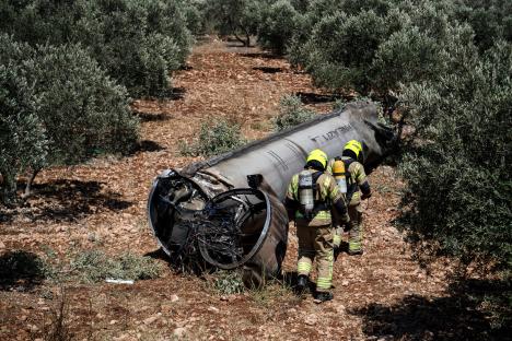 Israeli special forces examining the remains of a ballistic missile.
