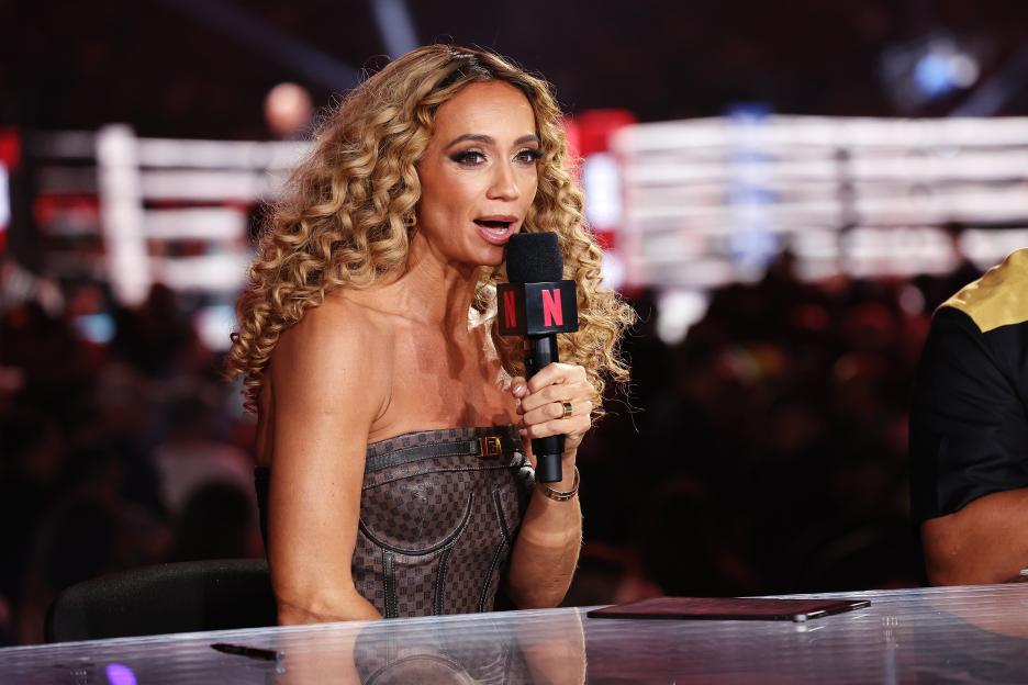 Kate Abdo speaking into a Netflix microphone.