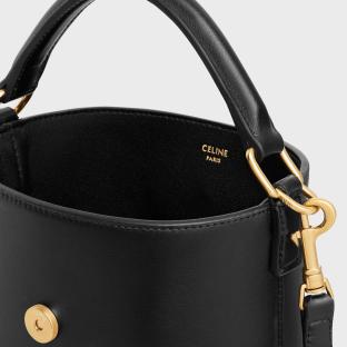 Close-up of the inside of a black Celine bucket bag.