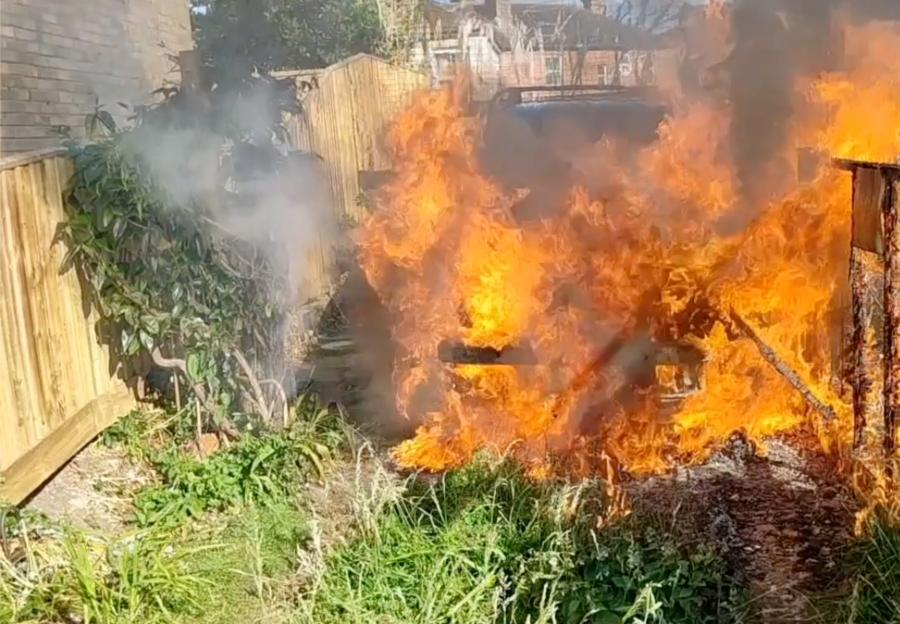 Land Rover engulfed in flames.