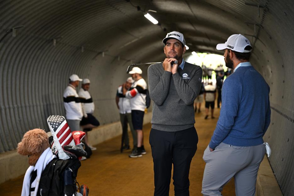 Keegan Bradley and Patrick Cantlay in a golf course tunnel.
