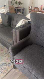 Dark gray couch and loveseat in a living room.