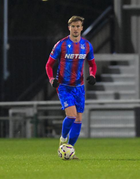 Rob Holding of Crystal Palace U21s dribbling the ball.