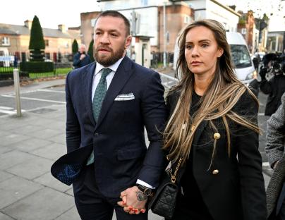 Conor McGregor and Dee Devlin leaving a court.