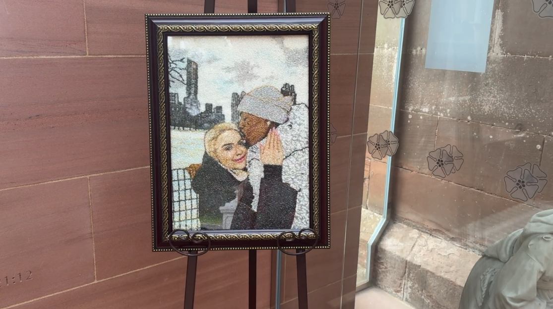 Framed rice portrait of a couple embracing.